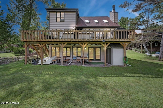 29 Tanglewood Ln, Lake Ariel, PA 18436 - back of house featuring a deck, a yard, a chimney, and stairs