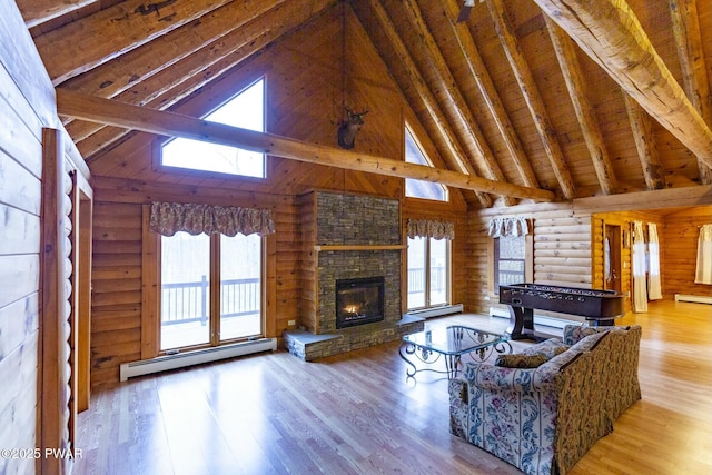 living room featuring baseboard heating, rustic walls, beamed ceiling, light hardwood / wood-style floors, and wood ceiling