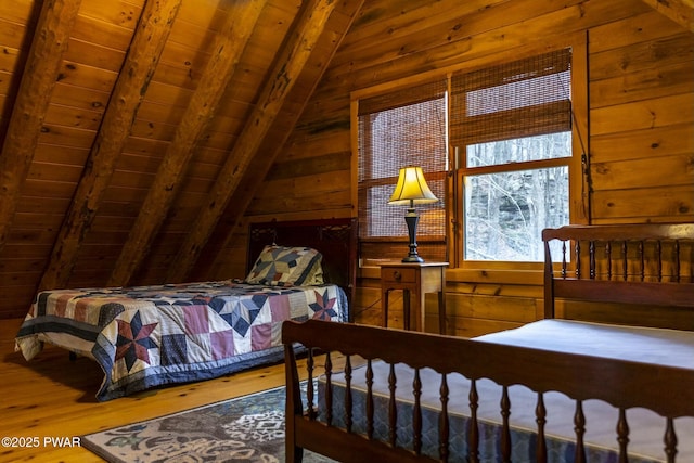 bedroom featuring lofted ceiling with beams, hardwood / wood-style flooring, wooden walls, and wood ceiling