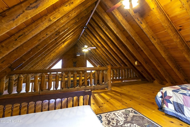 bedroom with vaulted ceiling with beams, wooden ceiling, and wood-type flooring