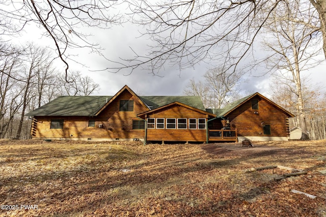 view of front of home with a sunroom