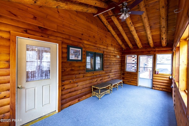 unfurnished sunroom with lofted ceiling with beams, ceiling fan, and wooden ceiling