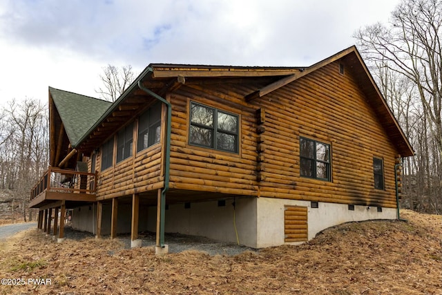 view of property exterior featuring a deck