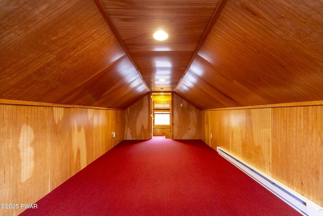 additional living space with carpet flooring, wood ceiling, a baseboard radiator, lofted ceiling, and wood walls