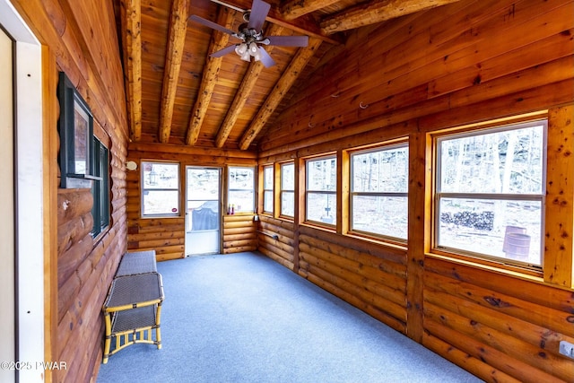 unfurnished sunroom featuring vaulted ceiling with beams, ceiling fan, and wood ceiling