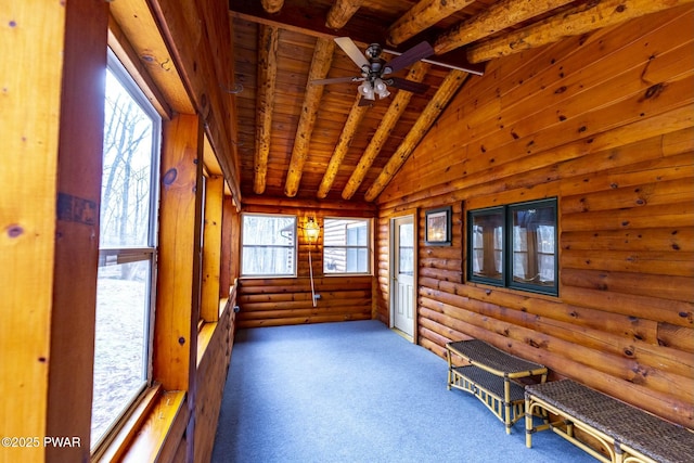 unfurnished sunroom with wood ceiling, a healthy amount of sunlight, ceiling fan, and lofted ceiling with beams