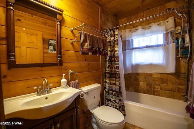 full bathroom with wooden ceiling, wood walls, toilet, shower / bath combo with shower curtain, and vanity