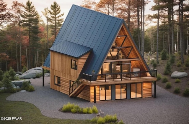 back house at dusk with a wooden deck