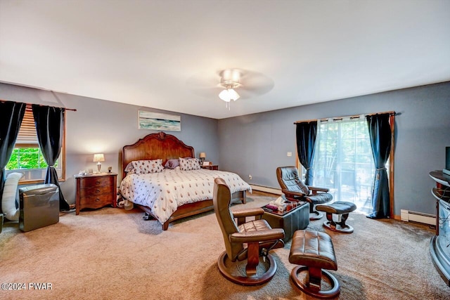 bedroom with carpet, ceiling fan, multiple windows, and a baseboard heating unit