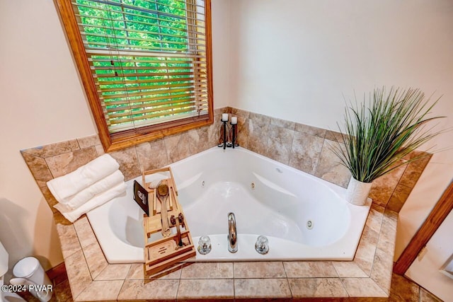 bathroom featuring tiled bath