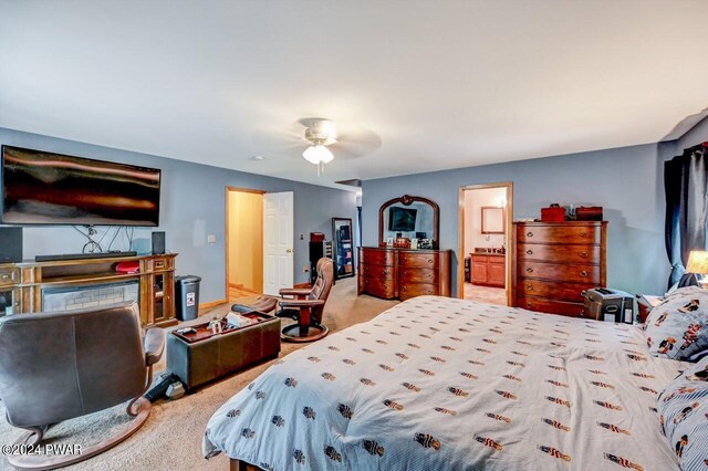 bedroom with light carpet and ceiling fan