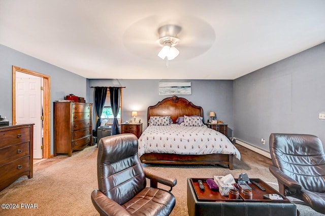 carpeted bedroom with ceiling fan and a baseboard radiator