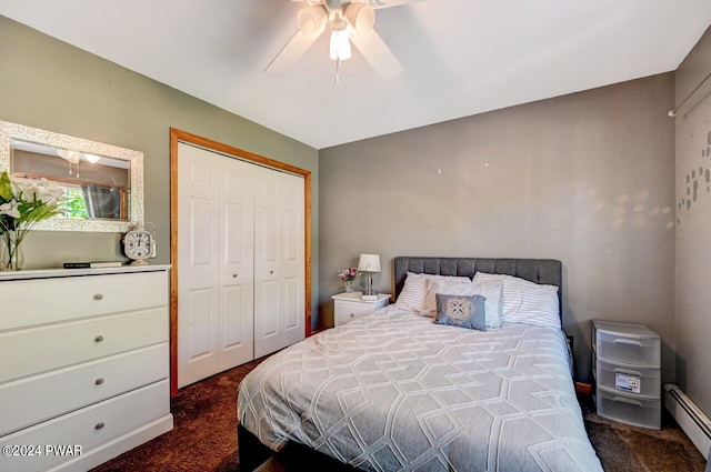 carpeted bedroom featuring baseboard heating, ceiling fan, and a closet