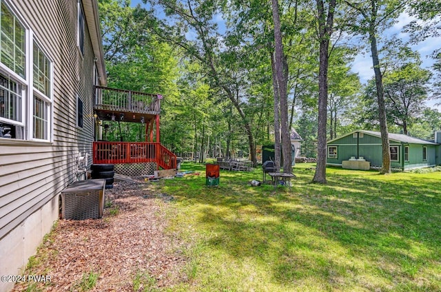 view of yard featuring central AC unit and a deck