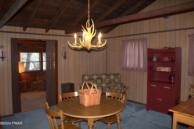 123 Mosier Rd, Dingmans Ferry, PA 18328 - carpeted dining room featuring vaulted ceiling with beams, a notable chandelier, wooden ceiling, and wood walls