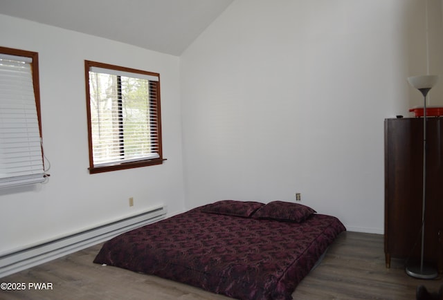 6372 Baltic Ave, Tobyhanna, PA 18466 - bedroom featuring a baseboard heating unit, wood finished floors, and vaulted ceiling