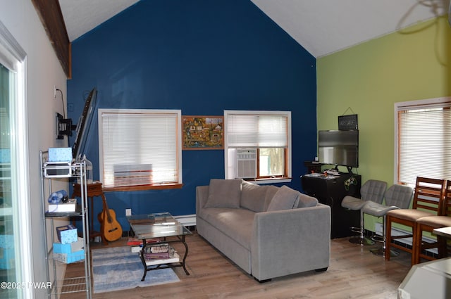 6372 Baltic Ave, Tobyhanna, PA 18466 - living room with high vaulted ceiling, plenty of natural light, and wood finished floors