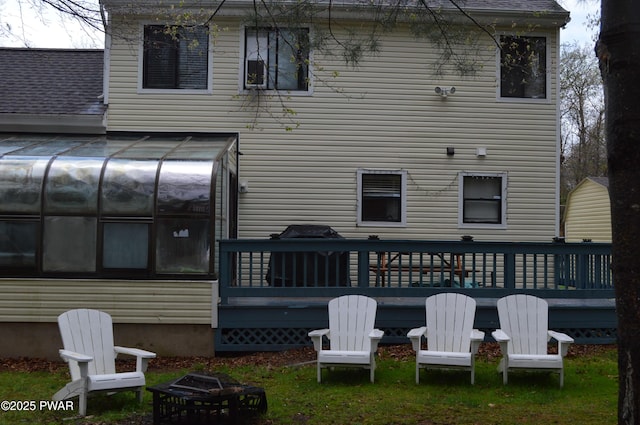 6372 Baltic Ave, Tobyhanna, PA 18466 - rear view of house with a sunroom and a wooden deck
