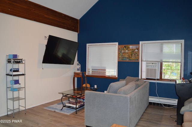 6372 Baltic Ave, Tobyhanna, PA 18466 - living area featuring high vaulted ceiling, baseboard heating, and wood finished floors