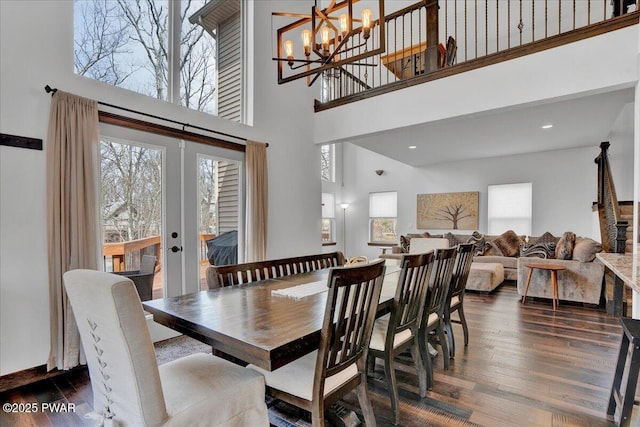 101 Maple Leaf Rd, Lackawaxen, PA 18435 - dining room with french doors, a chandelier, dark wood-style flooring, and a towering ceiling