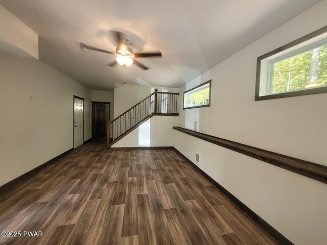 101 Maple Leaf Rd, Lackawaxen, PA 18435 - unfurnished room featuring dark wood-style flooring, ceiling fan, plenty of natural light, and stairway