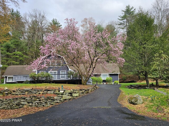 20 Chuck Foster Dr, Hawley, PA 18428 - view of front facade featuring a wooden deck and driveway