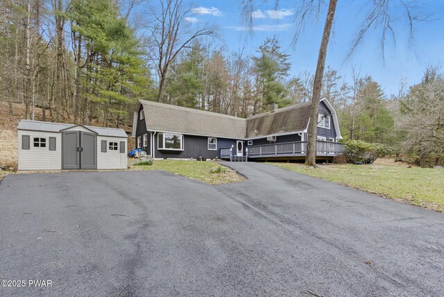 20 Chuck Foster Dr, Hawley, PA 18428 - dutch colonial with a storage unit, an outbuilding, driveway, and a chimney