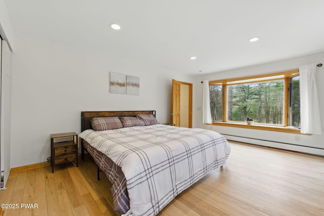 20 Chuck Foster Dr, Hawley, PA 18428 - bedroom featuring light wood finished floors, recessed lighting, baseboards, and a baseboard heating unit