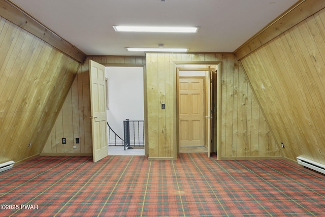 20 Chuck Foster Dr, Hawley, PA 18428 - additional living space featuring wooden walls, carpet floors, and baseboard heating