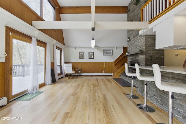 20 Chuck Foster Dr, Hawley, PA 18428 - living room with light wood-style flooring, a wainscoted wall, and a baseboard heating unit