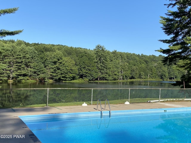 20 Chuck Foster Dr, Hawley, PA 18428 - view of pool featuring fence, a view of trees, and a water view