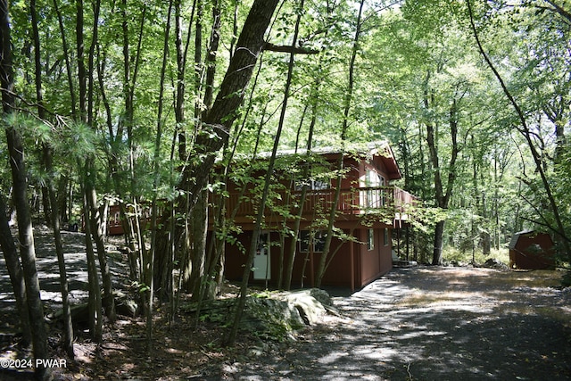 view of side of property featuring a deck