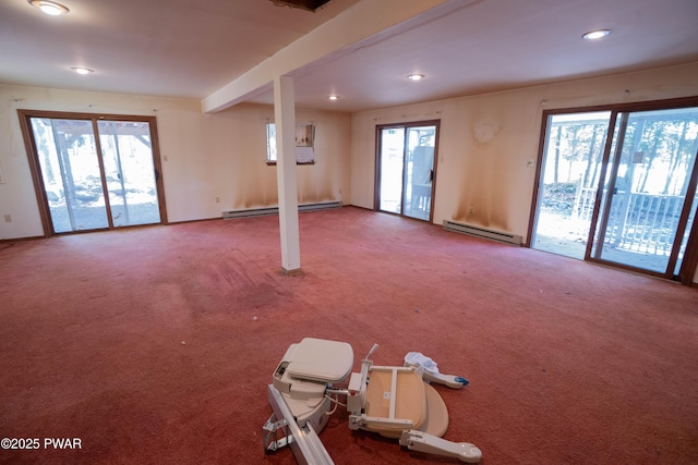 interior space with a baseboard radiator, recessed lighting, and a wealth of natural light