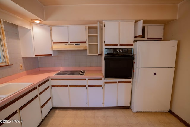 kitchen featuring tasteful backsplash, black appliances, and under cabinet range hood