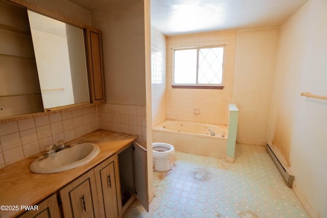 bathroom with a bathtub, a baseboard heating unit, toilet, and vanity