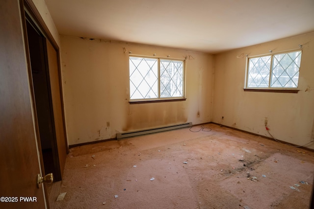 unfurnished bedroom with baseboard heating