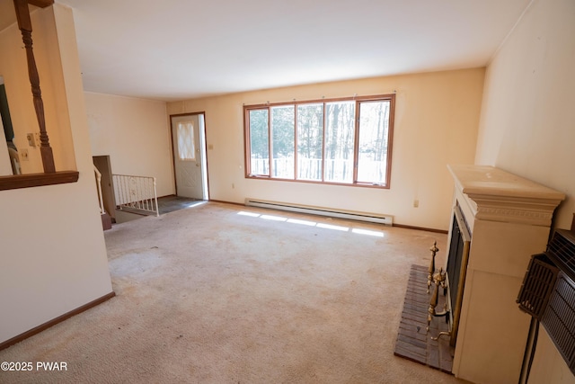 unfurnished living room featuring baseboards, baseboard heating, and carpet flooring