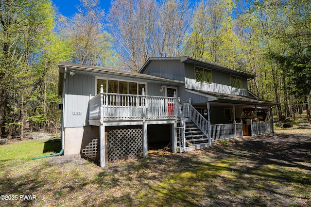 split level home featuring stairway and a porch