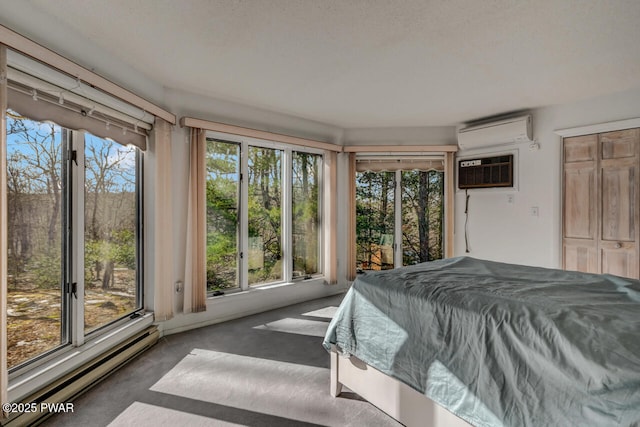 bedroom featuring a baseboard radiator, a wall mounted AC, and dark colored carpet