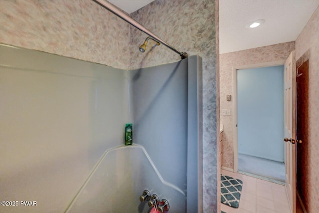 bathroom featuring walk in shower and tile patterned floors