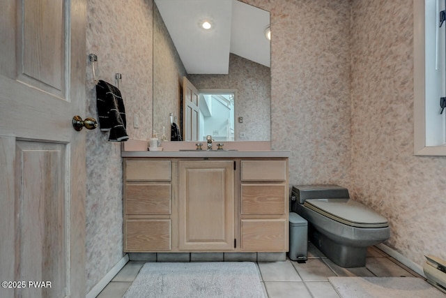 bathroom with tile patterned floors, vanity, and toilet