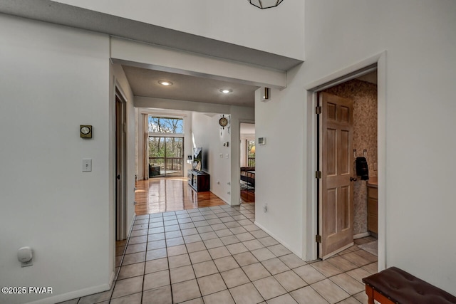 corridor with light tile patterned floors