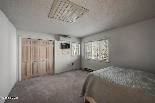 carpeted bedroom featuring a baseboard radiator, a wall mounted air conditioner, a textured ceiling, and a closet