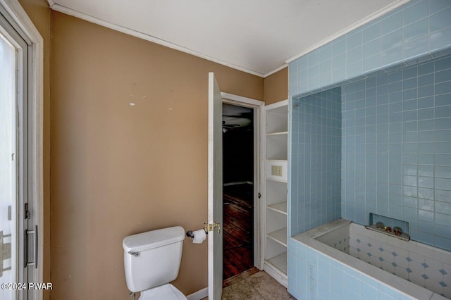 bathroom featuring tile patterned floors, toilet, and crown molding