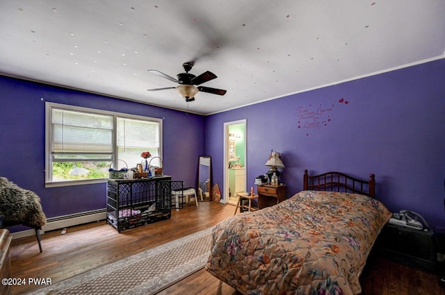 bedroom featuring hardwood / wood-style floors, baseboard heating, and ceiling fan