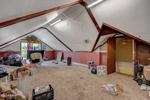 bonus room with carpet floors and lofted ceiling