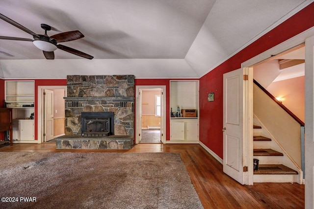 unfurnished living room with a baseboard heating unit, hardwood / wood-style flooring, ceiling fan, and lofted ceiling