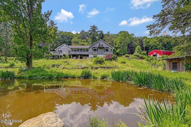 back of house with a water view