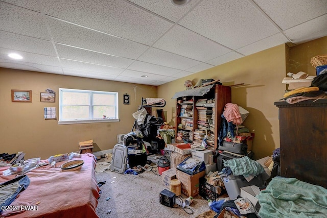 miscellaneous room featuring a paneled ceiling and carpet floors