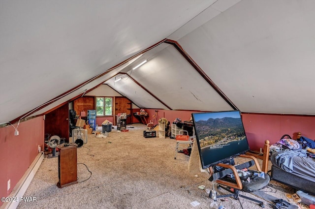 interior space featuring vaulted ceiling, carpet floors, and a baseboard radiator